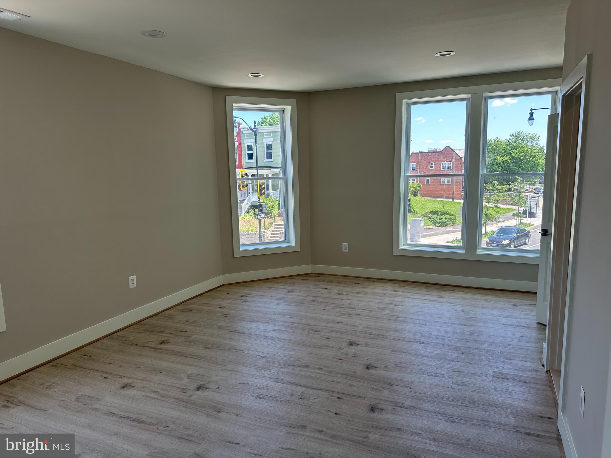 234 15th Street Northeast Washington, DC 20002 - Photo 6 of 15 an empty room with wooden floor and windows