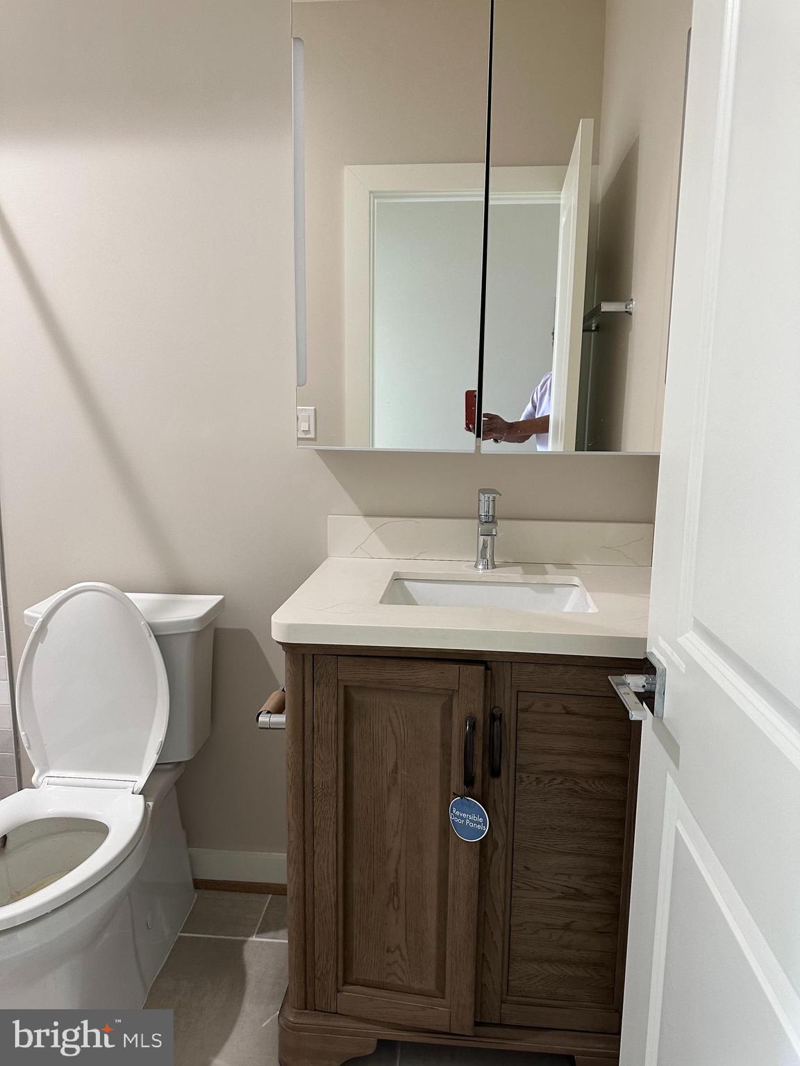 234 15th Street Northeast Washington, DC 20002 - Photo 10 of 15 a bathroom with a sink and a mirror