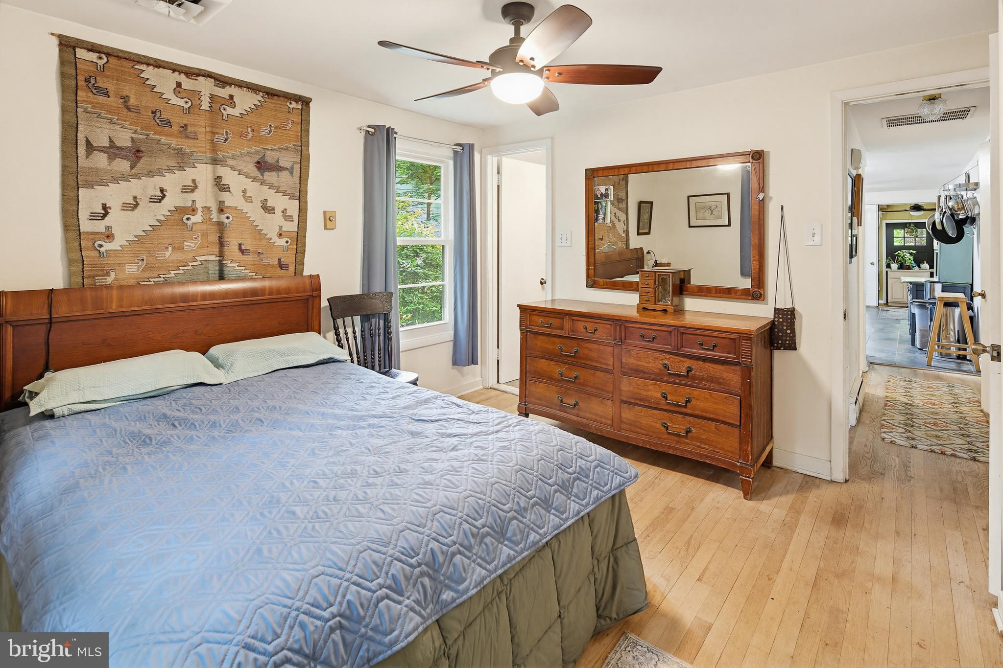 919 Blue Ridge Drive Annapolis, MD 21409 - Photo 14 of 30 a bedroom with a bed and wooden floor