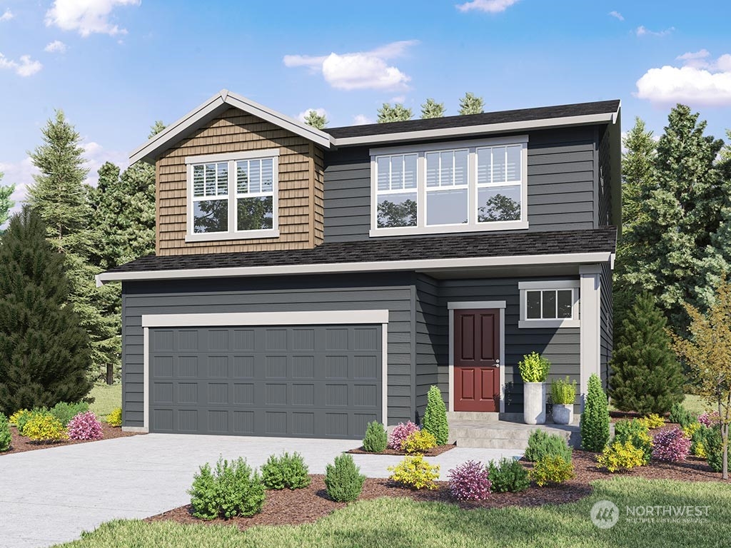 2728 193rd Place Southeast, Unit F11 Bothell, WA 98012 - Photo 1 of 29 a front view of a house with a yard and garage