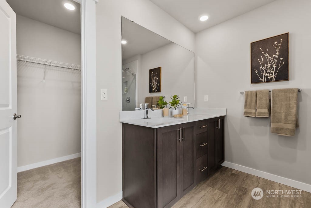 2728 193rd Place Southeast, Unit F11 Bothell, WA 98012 - Photo 27 of 29 a bathroom with a sink vanity and a mirror
