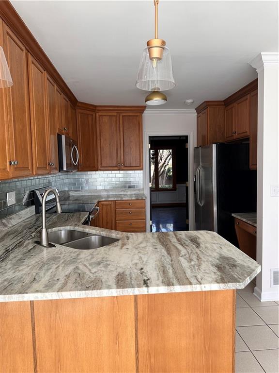 403 Landon Gate Pittsburgh, PA 15215 - Photo 15 of 27 a kitchen with kitchen island granite countertop a sink a stove and refrigerator