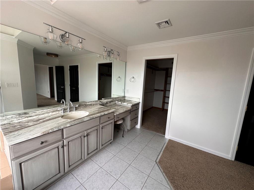 403 Landon Gate Pittsburgh, PA 15215 - Photo 20 of 27 a bathroom with a granite countertop sink and a mirror
