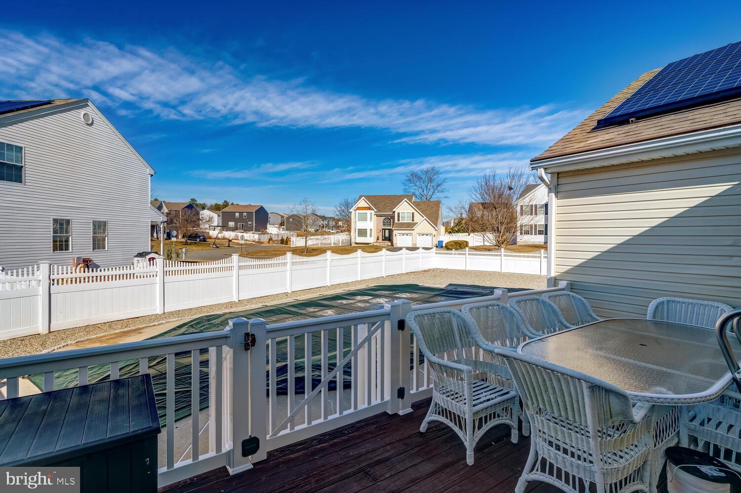 148 Compass Road Manahawkin, NJ 08050 - Photo 11 of 40 a balcony with table and chairs