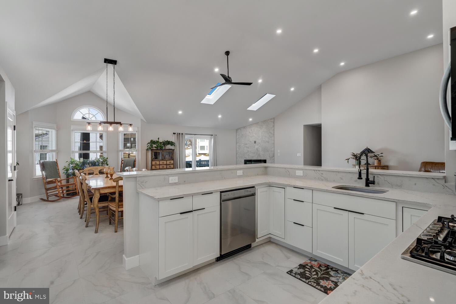 148 Compass Road Manahawkin, NJ 08050 - Photo 18 of 40 a kitchen with sink stove and cabinets