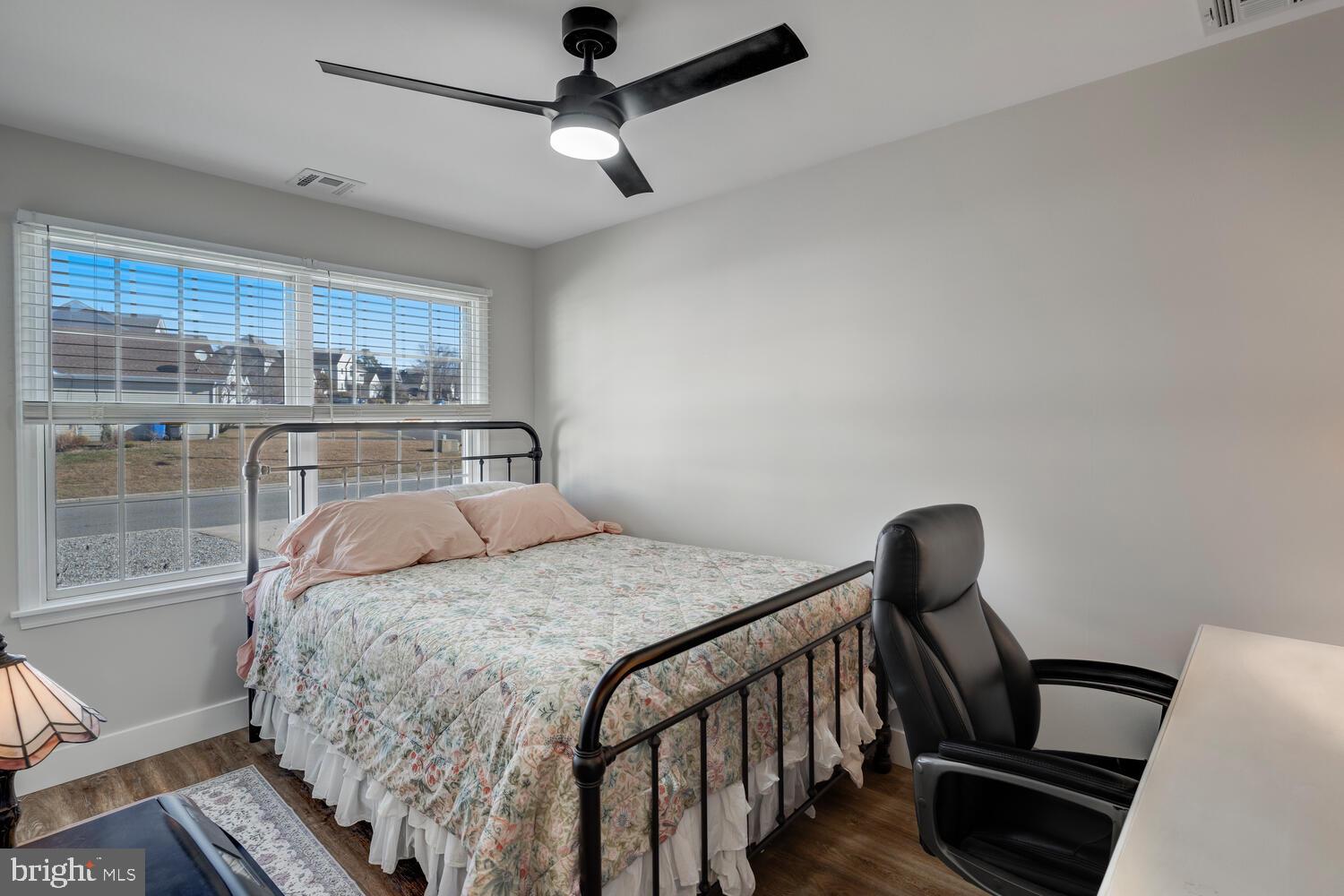 148 Compass Road Manahawkin, NJ 08050 - Photo 31 of 40 a bedroom with a bed and wooden floor