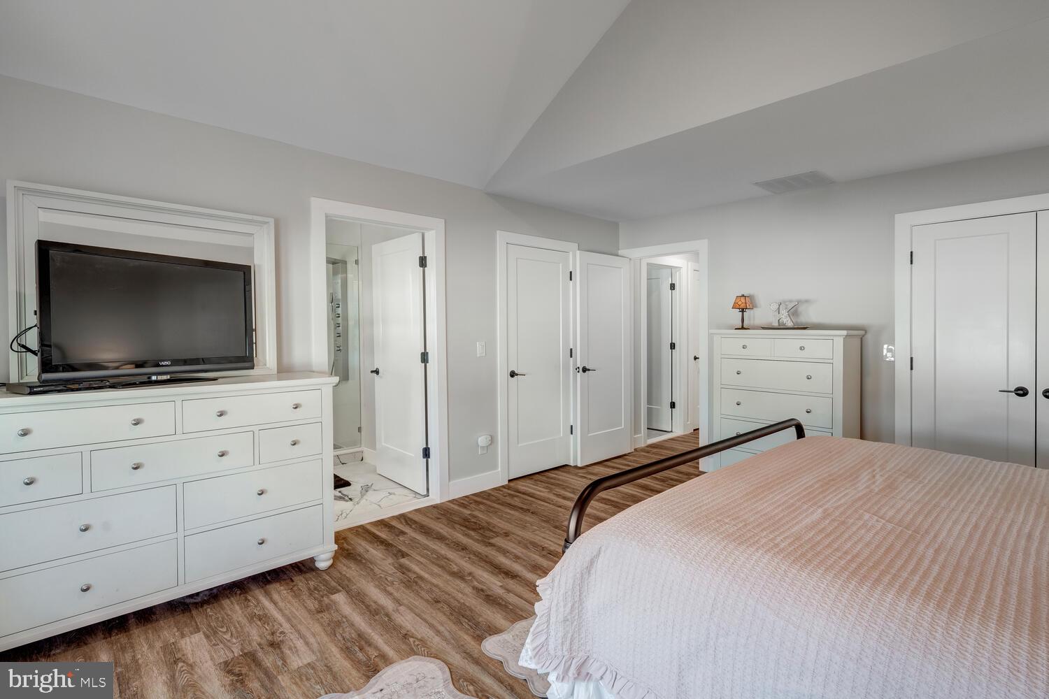 148 Compass Road Manahawkin, NJ 08050 - Photo 36 of 40 a bedroom with a large bed and flat screen tv