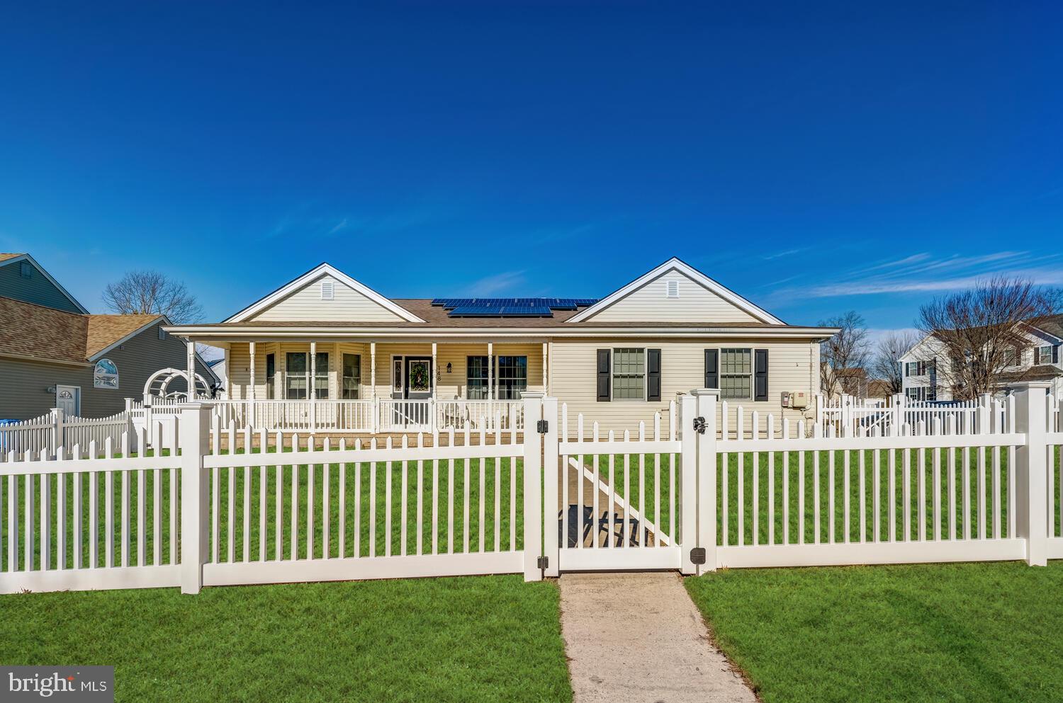 148 Compass Road Manahawkin, NJ 08050 - Photo 40 of 40 a front view of a house with a garden