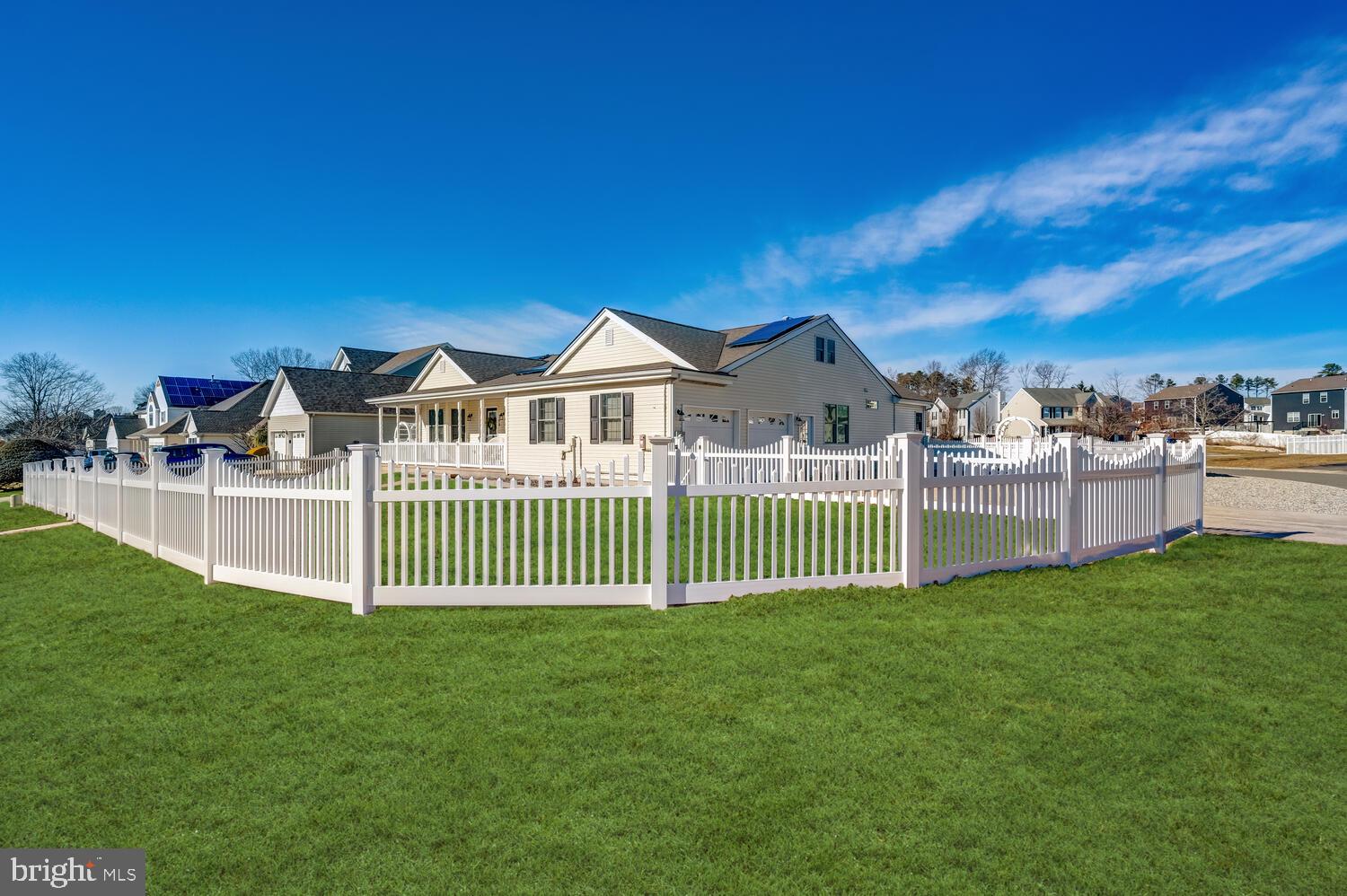 148 Compass Road Manahawkin, NJ 08050 - Photo 6 of 40 a view of a house with a deck and a yard