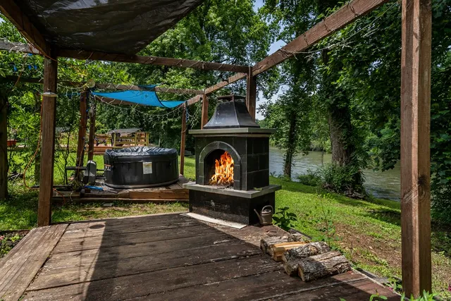 a view of a dining room with furniture large windows and wooden floor