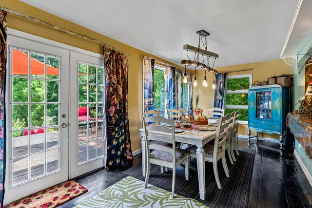 a bed room with furniture and a flat screen tv