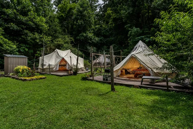 a backyard of a house with outdoor seating