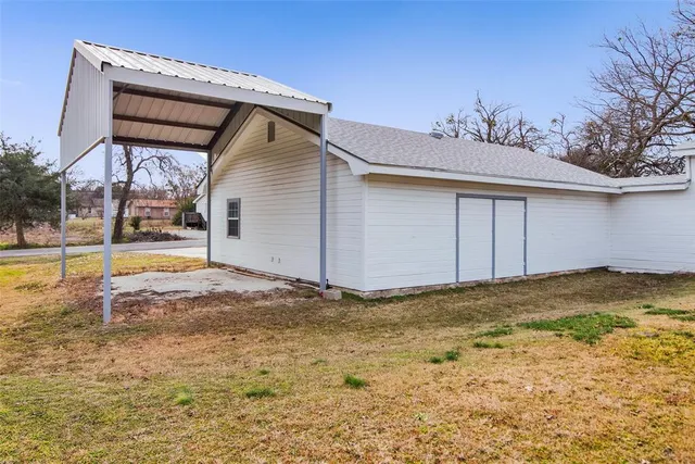 a view of a house with pool and yard
