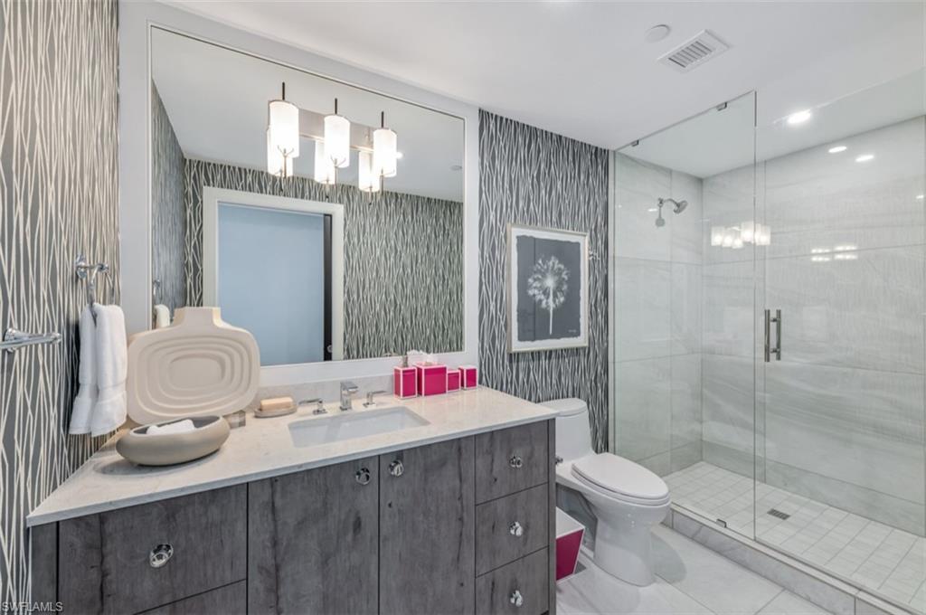 13925 Old Coast Road, Unit 403 Naples, FL 34110 - Photo 18 of 24 Full bathroom featuring wallpapered walls, vanity, a shower stall, light tile patterned flooring, and recessed lighting