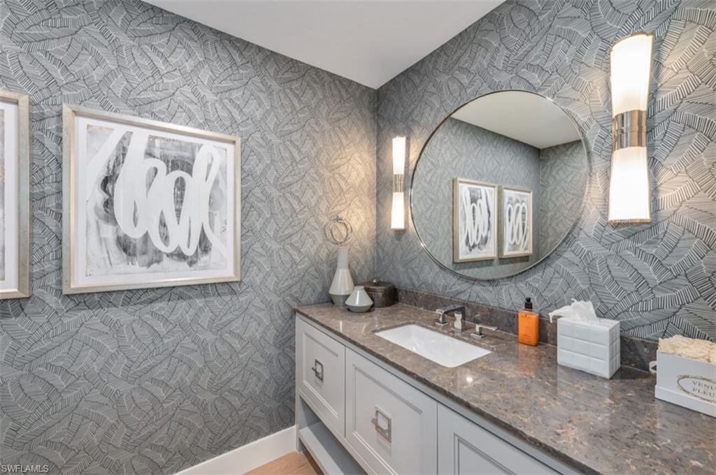 13925 Old Coast Road, Unit 403 Naples, FL 34110 - Photo 19 of 24 Bathroom with vanity and wallpapered walls