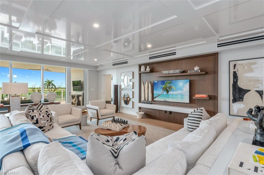 13925 Old Coast Road, Unit 403 Naples, FL 34110 - Photo 5 of 24 Living room with wood finished floors and recessed lighting