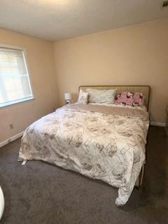 1625 Conley Road, Unit 21 Conley, GA 30288 - Photo 14 of 17 a bed sitting in a bedroom next to a window