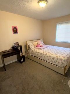 1625 Conley Road, Unit 21 Conley, GA 30288 - Photo 15 of 17 a bed sitting in a bedroom next to a window