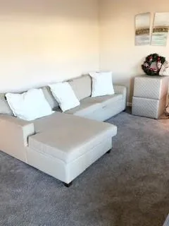 a living room with furniture and a couch