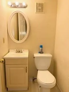 a bathroom with a toilet and a sink
