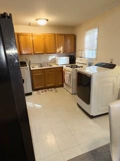 1625 Conley Road, Unit 21 Conley, GA 30288 - Photo 7 of 17 a kitchen with stainless steel appliances granite countertop a stove a sink and a refrigerator