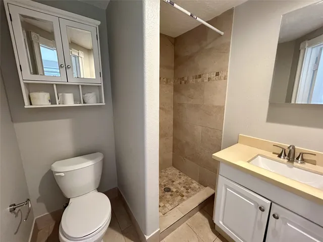 a view of a porch with wooden floor