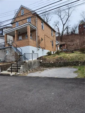 a view of a house with a street