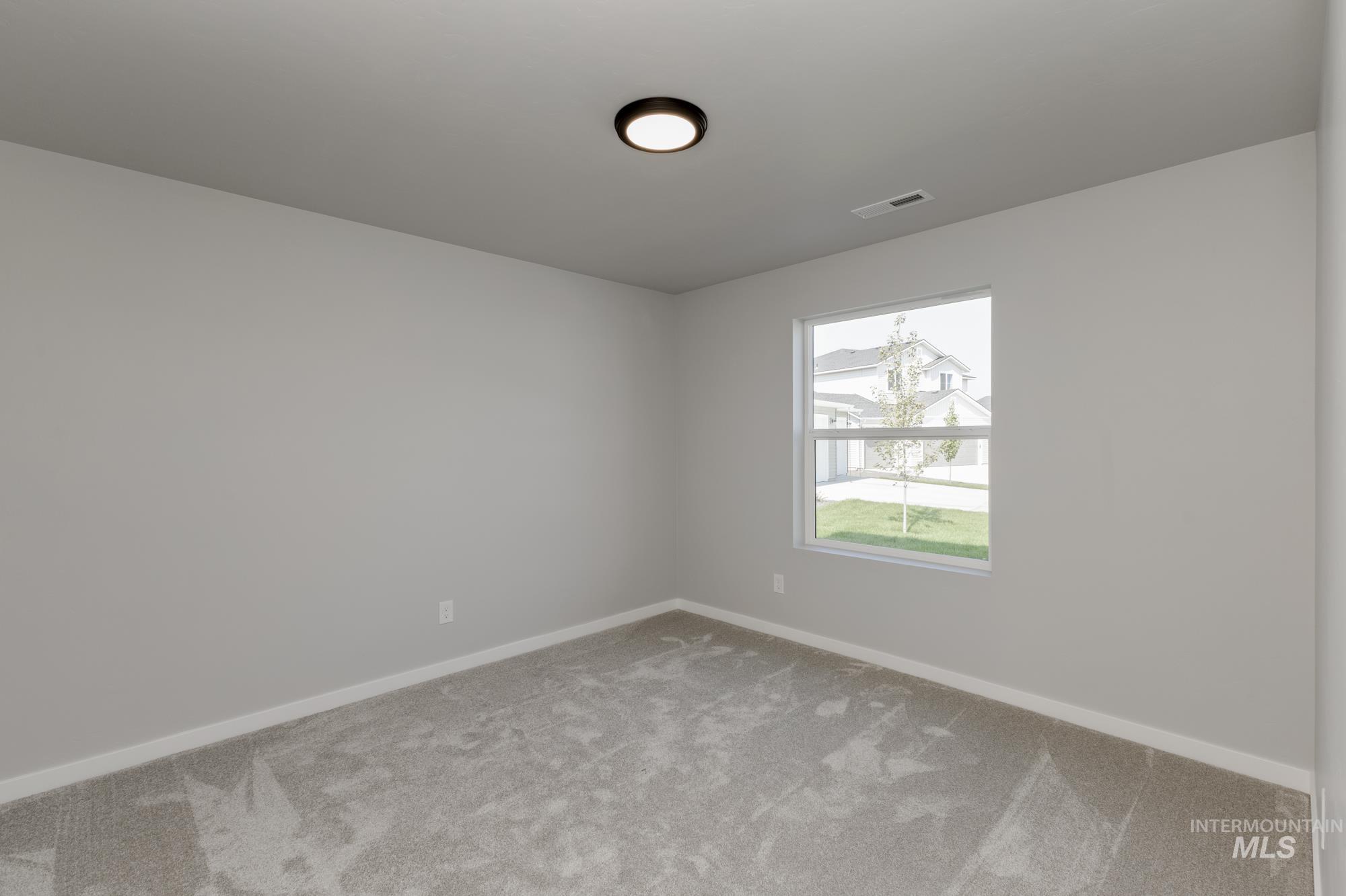 16262 Backfill Place Caldwell, ID 83607 - Photo 12 of 25 Carpeted spare room with baseboards