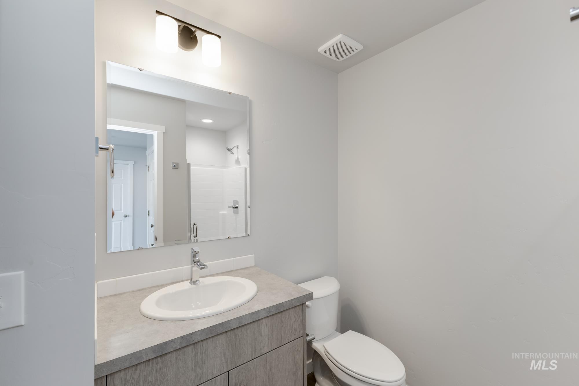 16262 Backfill Place Caldwell, ID 83607 - Photo 13 of 25 Bathroom featuring vanity and a shower