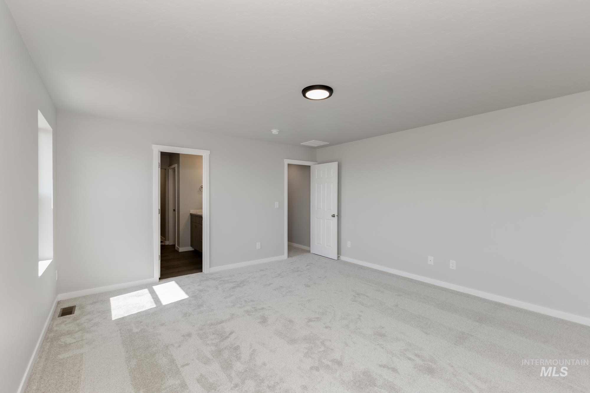 16262 Backfill Place Caldwell, ID 83607 - Photo 23 of 25 Unfurnished bedroom with carpet floors and ensuite bath