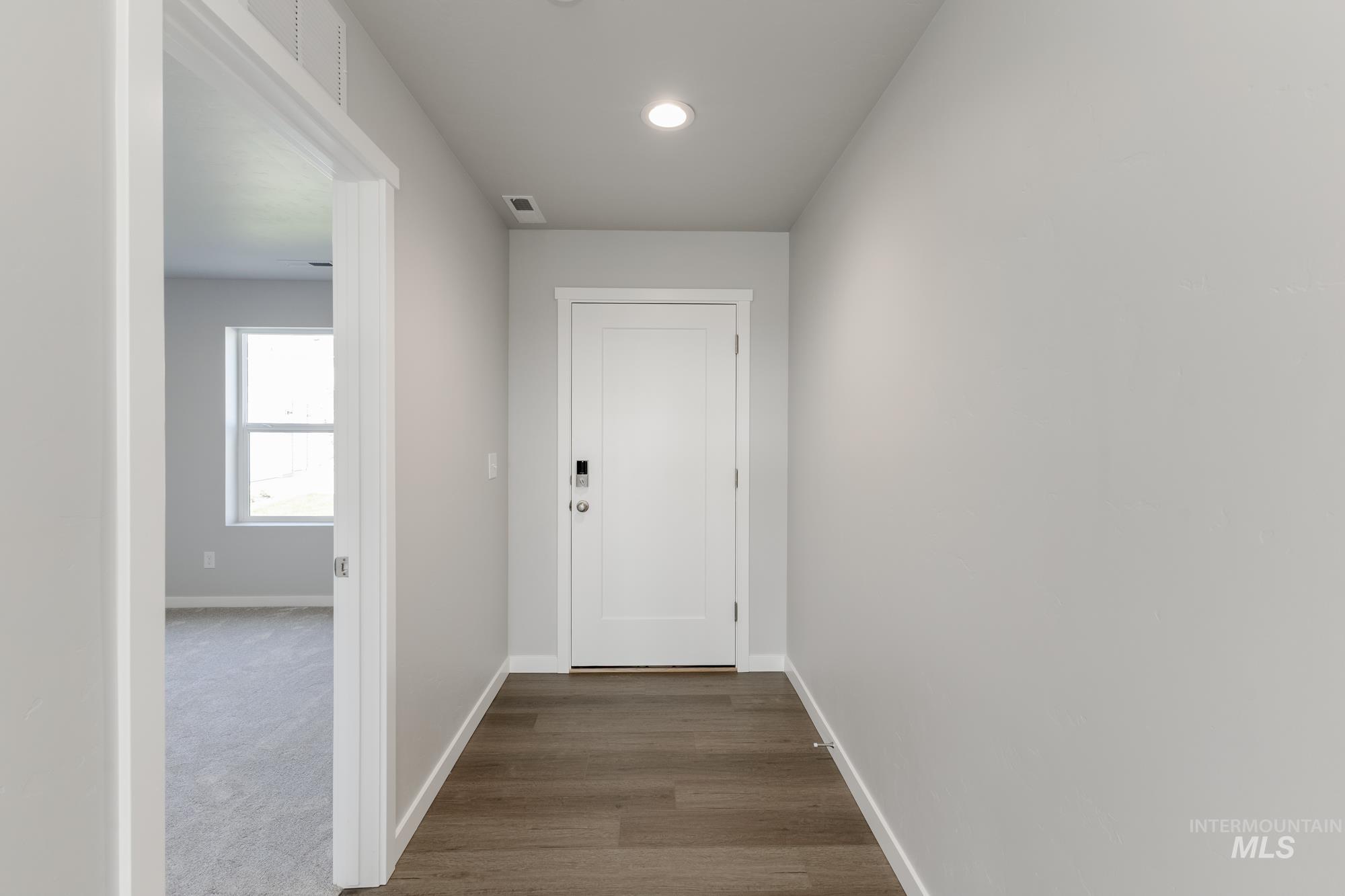 16262 Backfill Place Caldwell, ID 83607 - Photo 3 of 25 Hall featuring dark wood-style floors and recessed lighting