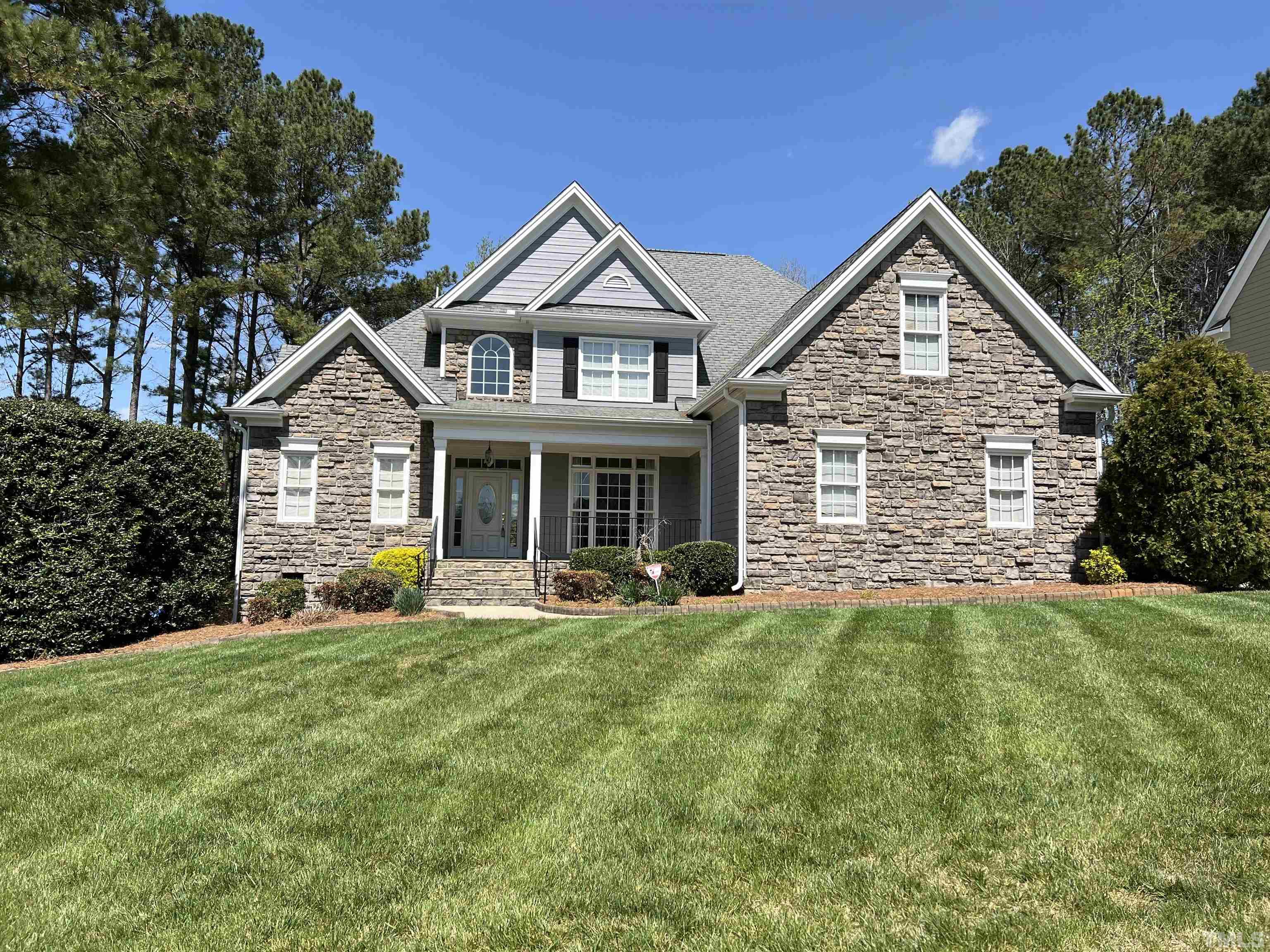 236 Waterville Street Raleigh, NC 27603 - Photo 1 of 30 a front view of a house with a yard and porch
