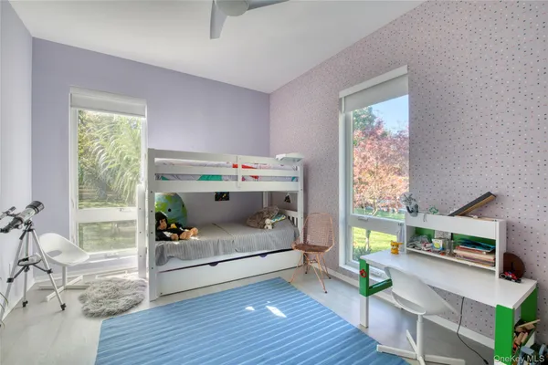 a bedroom with furniture and a window