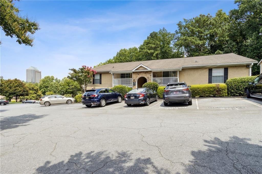 3155 Seven Pines, Unit 303 Atlanta, GA 30339 - Photo 21 of 25 a view of a car parked in front of a house