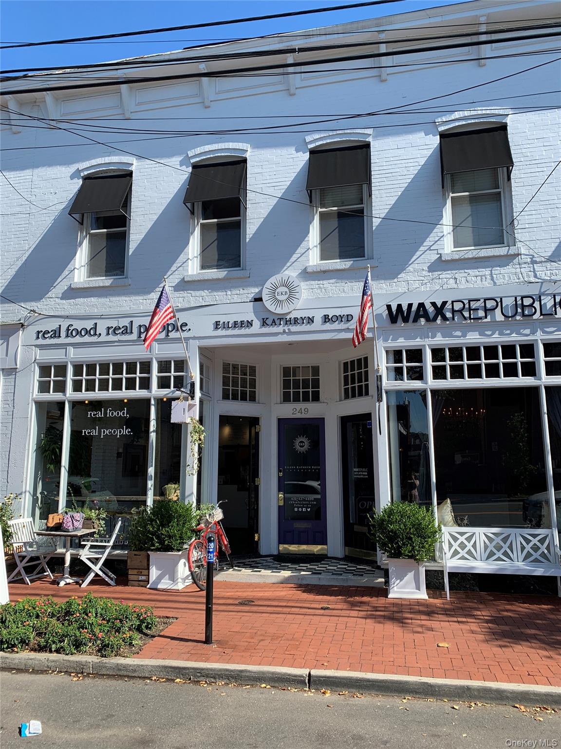 249 Main Street, Unit EAST Huntington, NY 11743 - Photo 2 of 11 a front view of a building with street