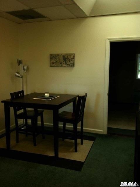 249 Main Street, Unit EAST Huntington, NY 11743 - Photo 7 of 11 a view of a dining room with furniture and wooden floor