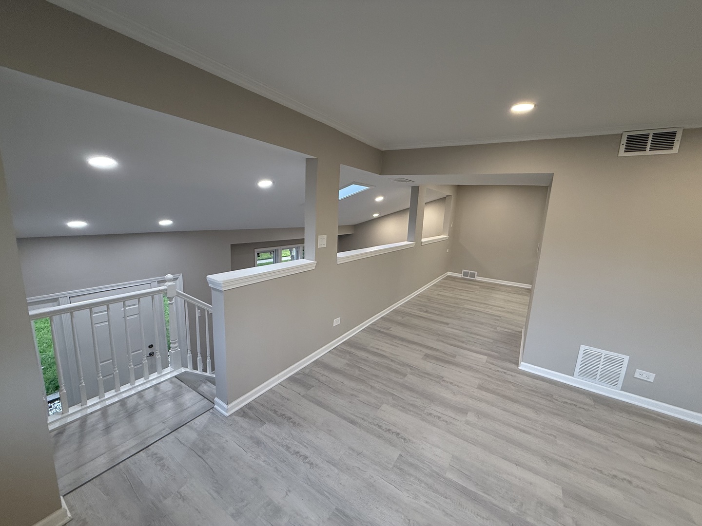 337 Woodland Drive Grayslake, IL 60030 - Photo 16 of 35 a view of an empty room with wooden floor