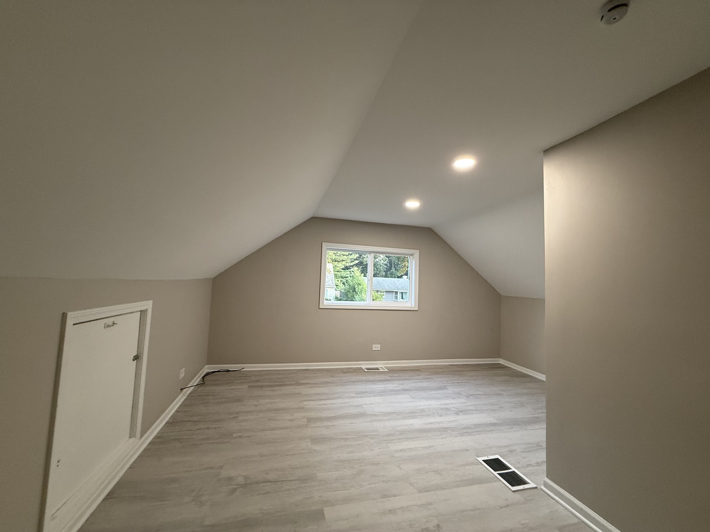337 Woodland Drive Grayslake, IL 60030 - Photo 24 of 35 an empty room with wooden floor and windows