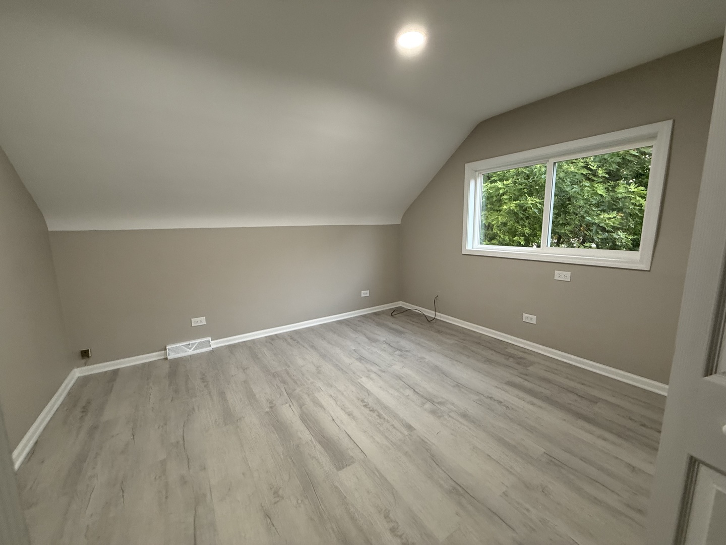 337 Woodland Drive Grayslake, IL 60030 - Photo 28 of 35 an empty room with wooden floor and windows