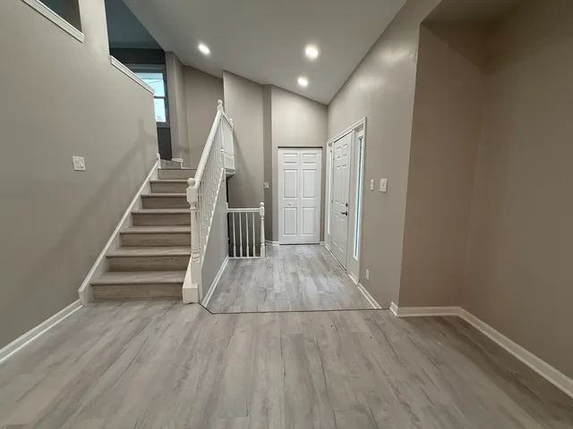 a view of entryway with wooden floor