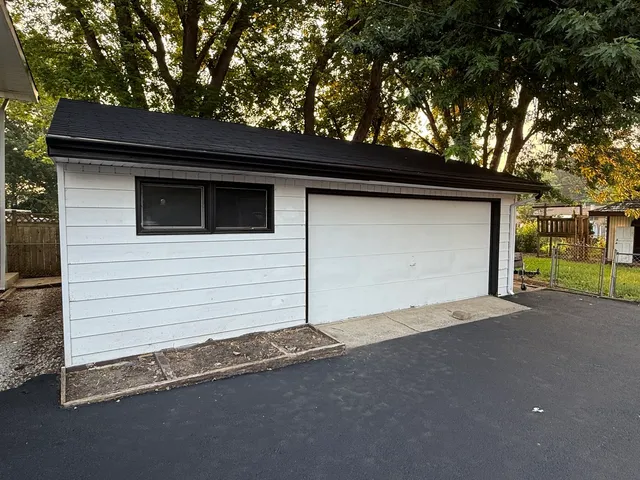 a backyard of a house with garage