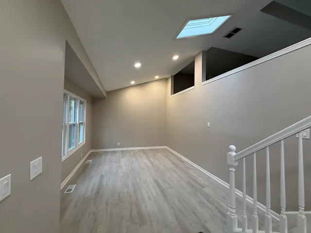 a view of an entryway with wooden floor