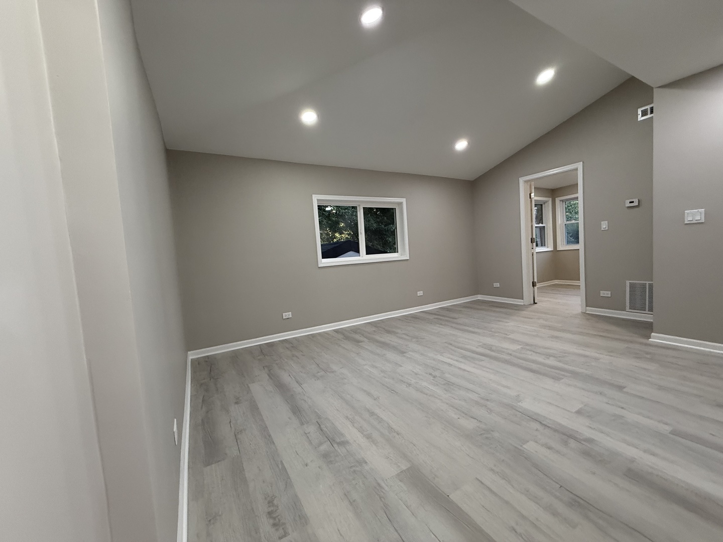 337 Woodland Drive Grayslake, IL 60030 - Photo 6 of 35 an empty room with wooden floor and windows