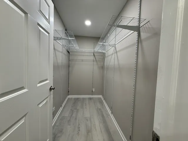 a bathroom with a shower and a sink