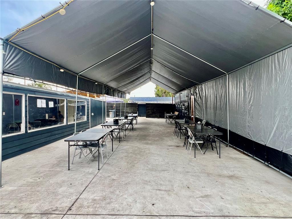 6101 Symmes Road Gibsonton, FL 33534 - Photo 18 of 21 a view of a porch with chairs and table in a patio