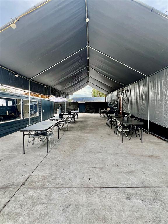 6101 Symmes Road Gibsonton, FL 33534 - Photo 19 of 21 a view of a garage with wooden table and chairs
