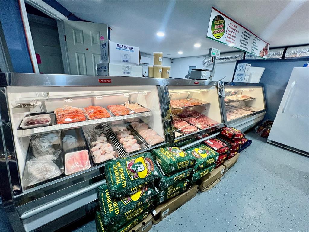 6101 Symmes Road Gibsonton, FL 33534 - Photo 7 of 21 an outdoor living room with furniture and a flat screen tv