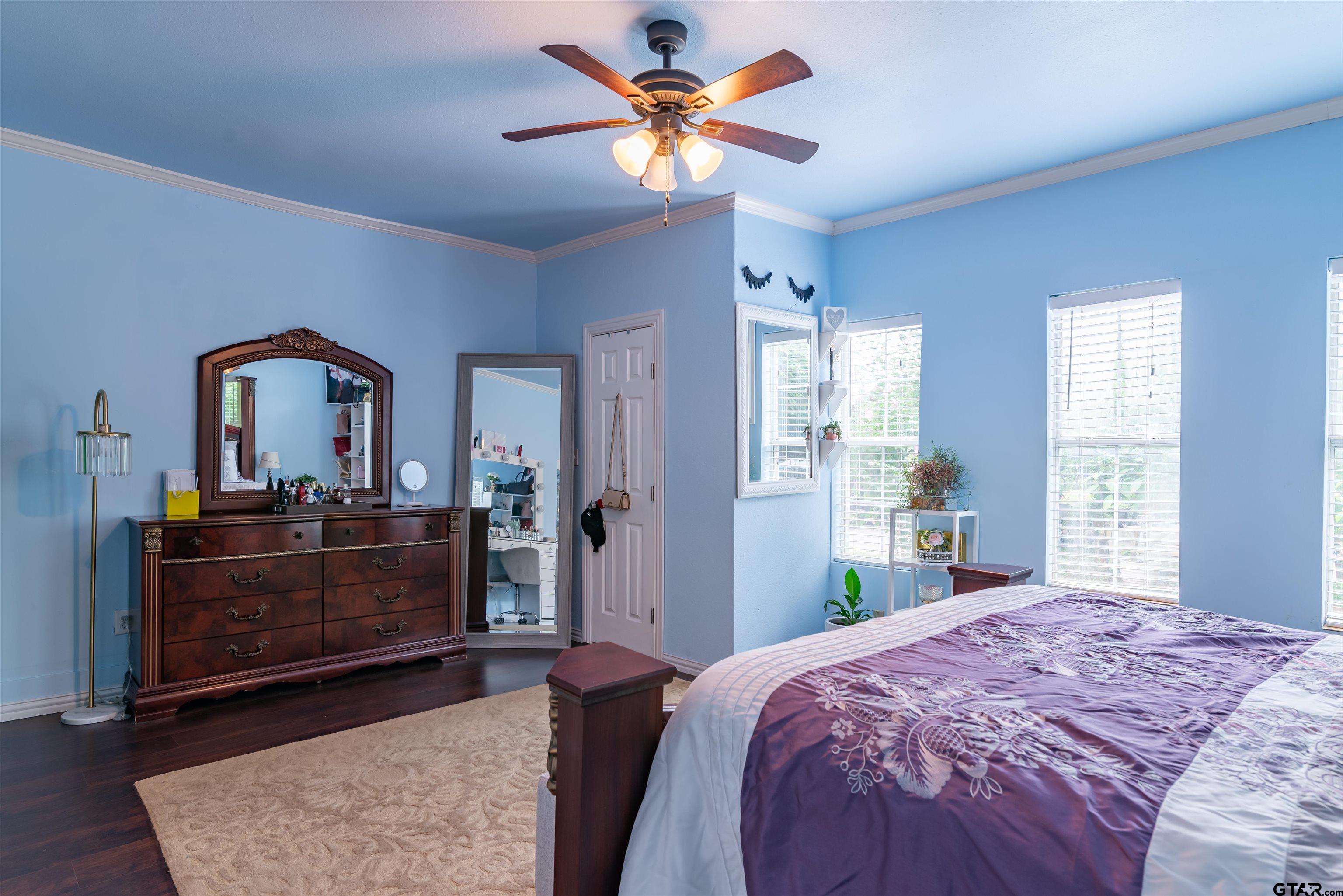 427 East Locust Street Tyler, TX 75702 - Photo 18 of 42 a bedroom with a bed and a dresser