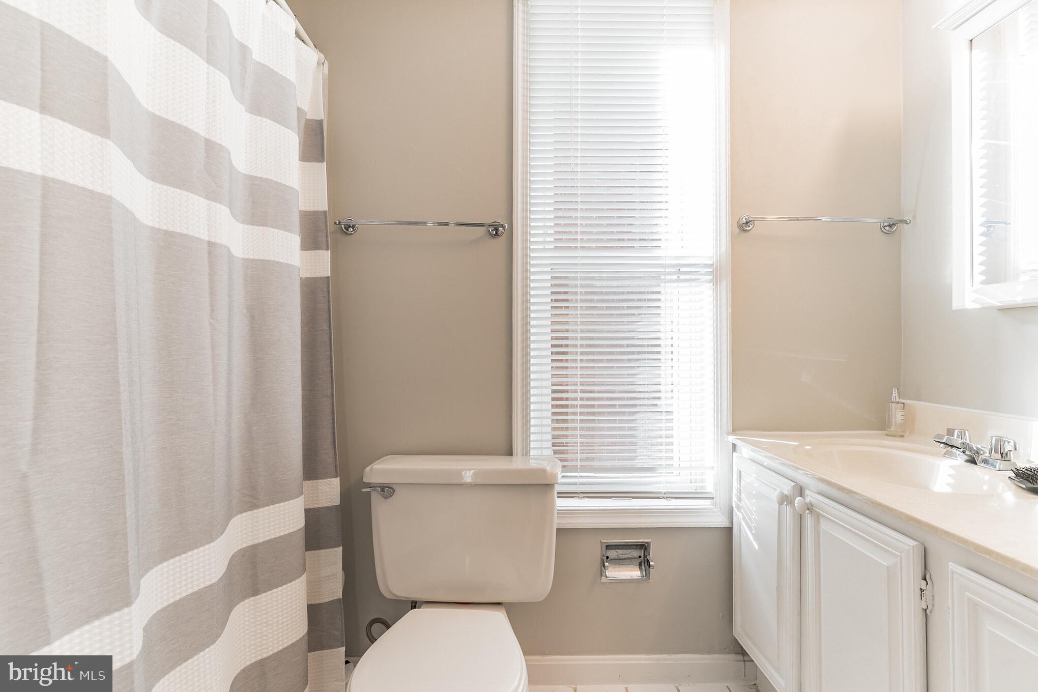 1208 1/2 33rd Street Northwest Washington, DC 20007 - Photo 24 of 30 a bathroom with a sink toilet and shower