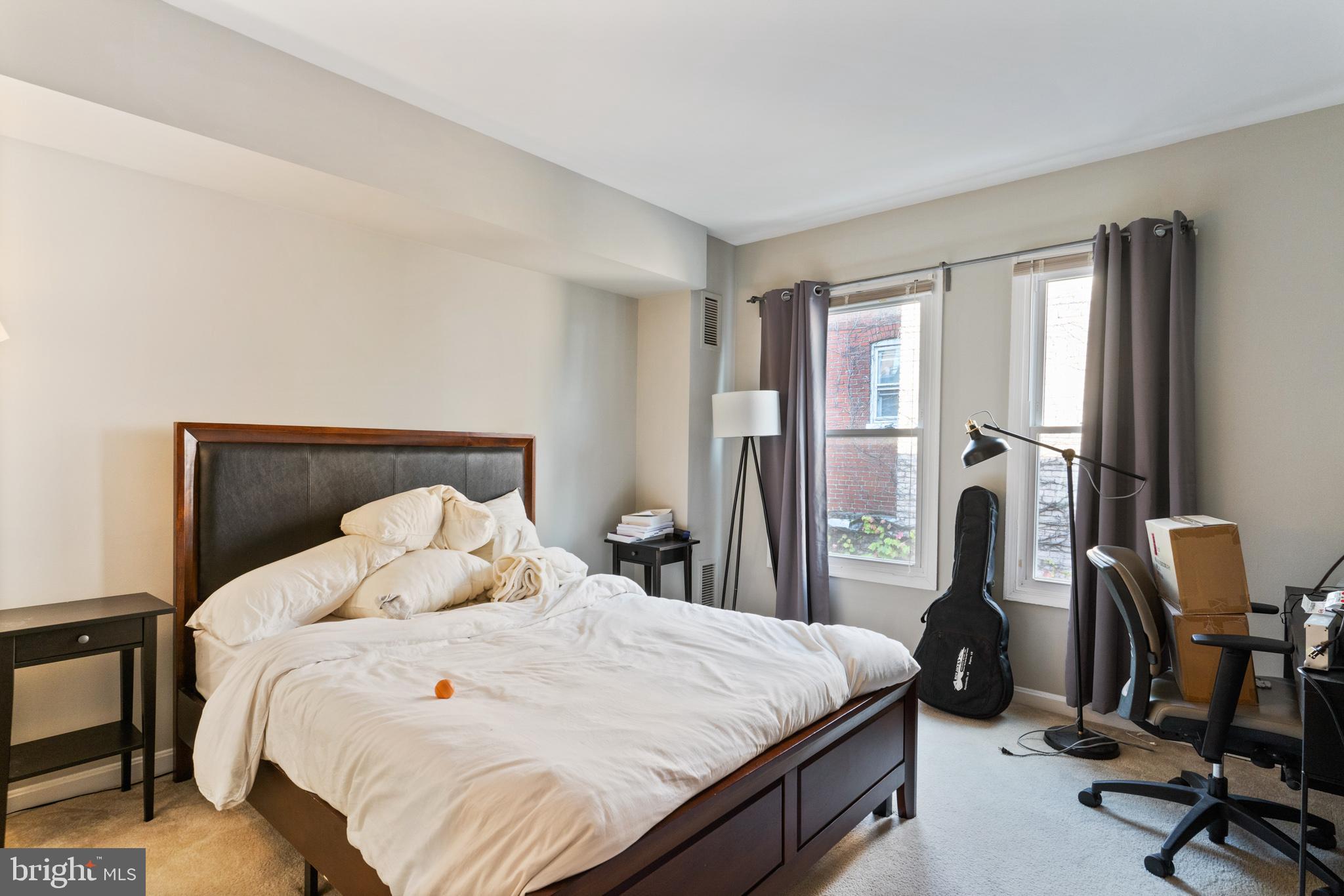 1208 1/2 33rd Street Northwest Washington, DC 20007 - Photo 25 of 30 a bedroom with a bed a desk and chair